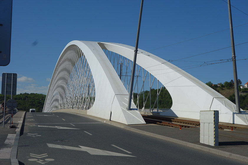 The arch is a welded steel box beam, dividing at either end to allow passage of the electric trams. There are two sets of hangers from each arch.