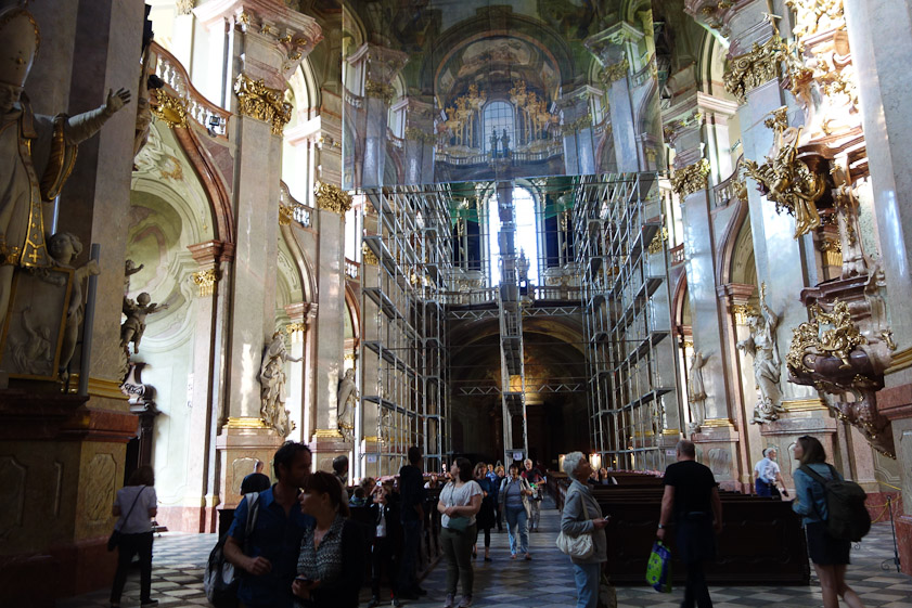 St. Nicholas is being restored, and a large scaffolding obscures much of the vault. It has a photograph printed on a screen to show what is behind it, though. This is a view from the east looking west down the nave.