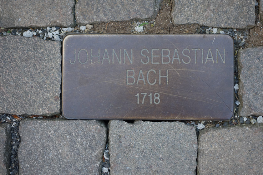 The brick pavement in front of the Pupp includes brass markers of previous guests.