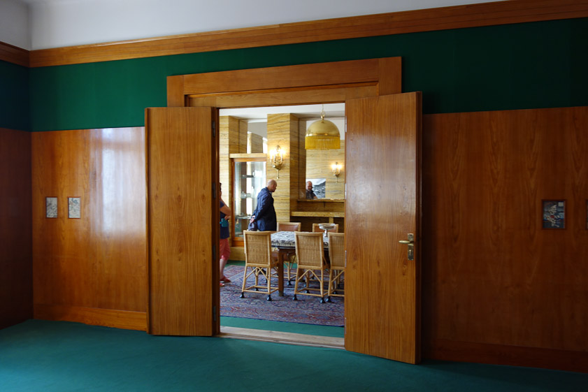 The doorway leading from the living room to the dining room.