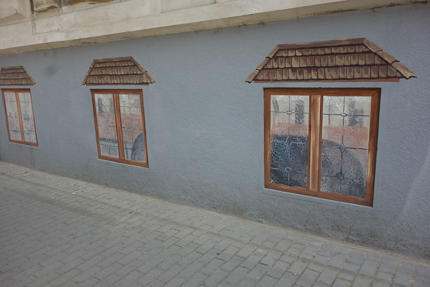 We walked past these trompe d'oeil windows painted on a building's basement wall.