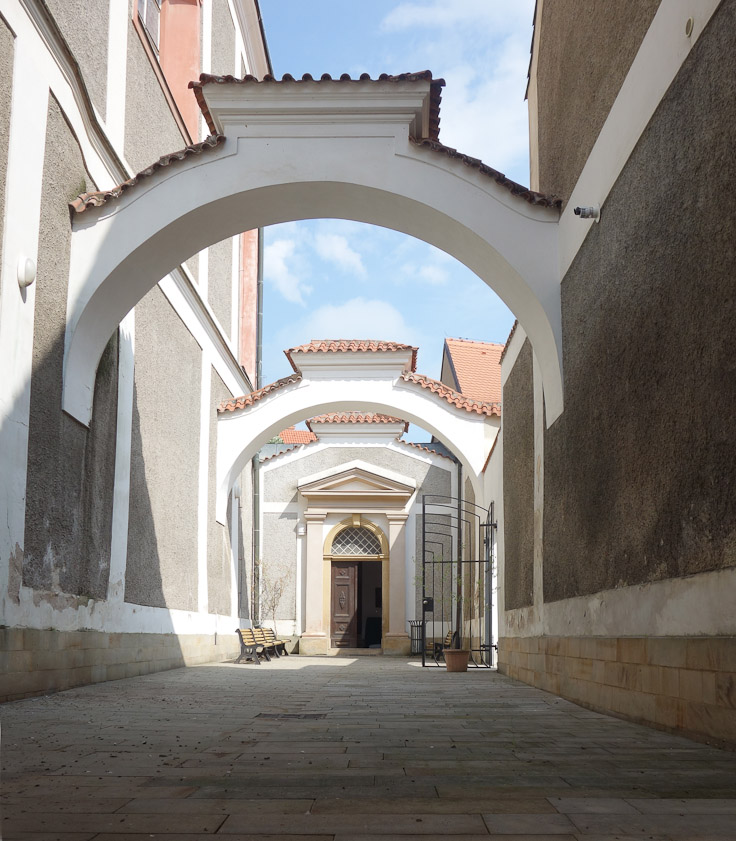 Arches over the passage along the south wall of the Church of St. John Nepomuk leading to the south door.