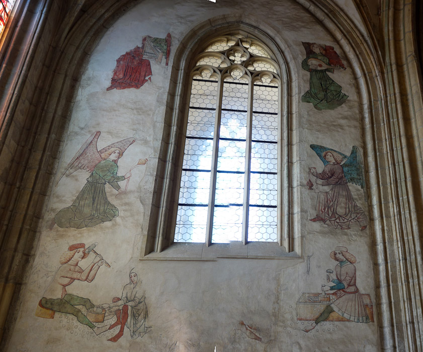 The west wall of the Minters' Chapel in the SW corner of the church was decorated with frescoes after 1463. A window was inserted in the 19c before the frescoes were discovered, destroying an image of the Virgin Mary.