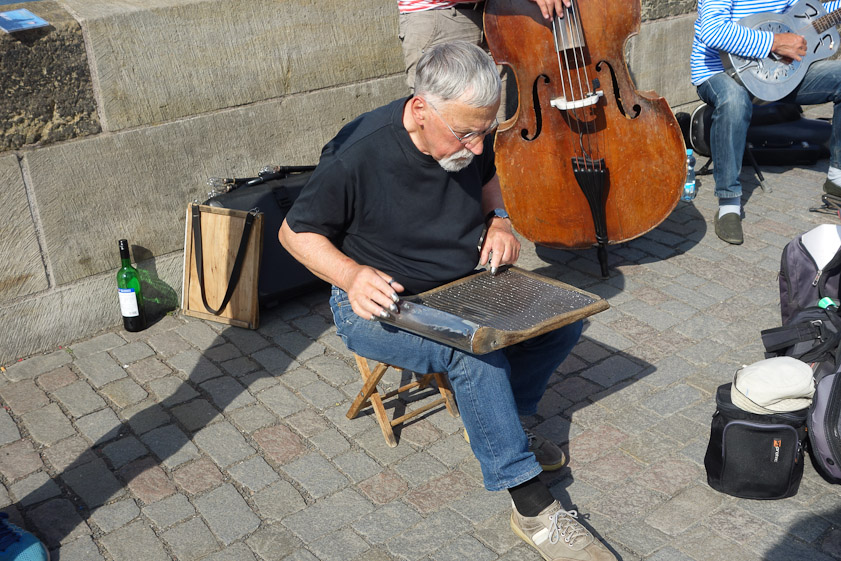 Various musical groups were performing on the bridge (none were amplifiied) including one with this man tapping a washboard with metal fingertips.