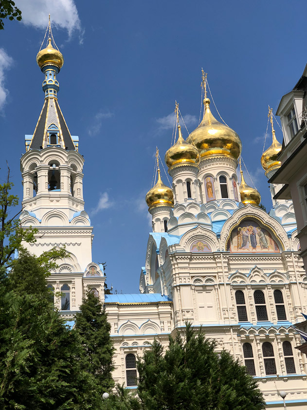 A view of the towers of St. Peter & Paul from the south. The entrance (west door) is under the tall tower on the left.