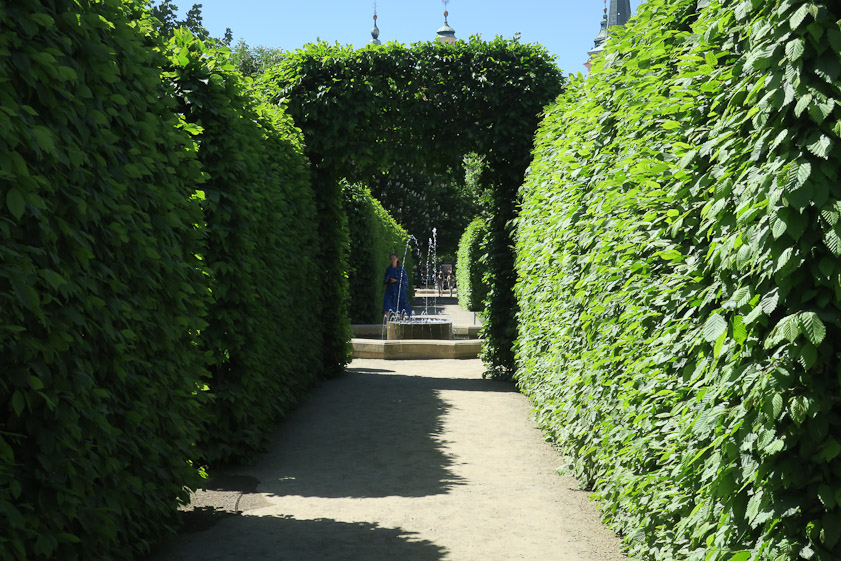 The garden is mostly hedges and fountains.