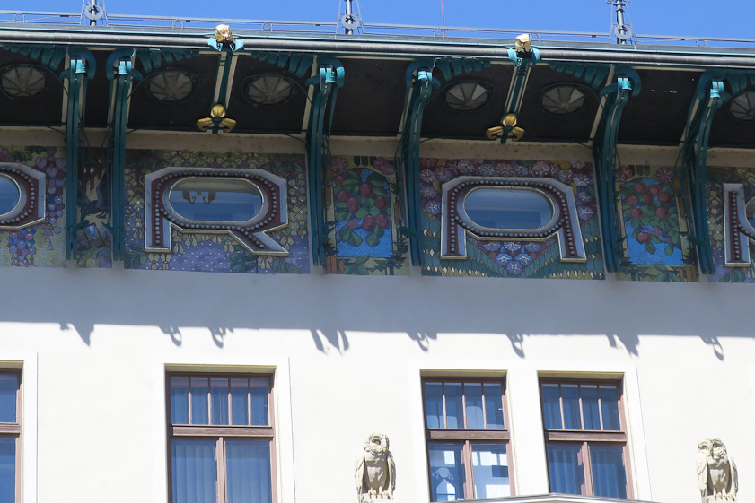 Under the eaves, in shadow, it reads 