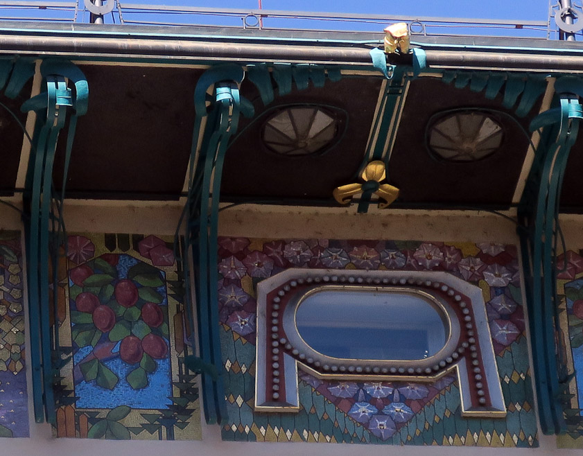 A detail of the colorful mosaic frieze.