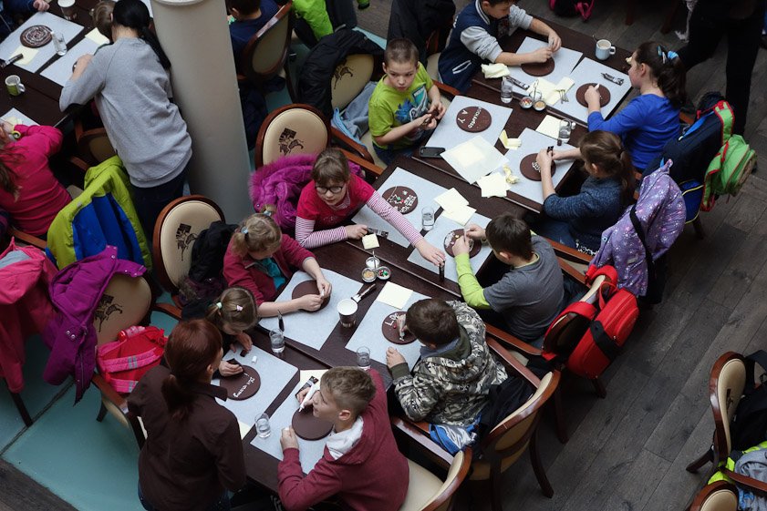 Meanwhile, children were entertaining themselves at Wedel's chocolate cafe by decorating chocolate covered waffles with tubes of while chocolate, jelly beans, etc.