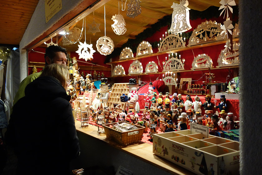 This stand sold Christmas ornaments and decorations.