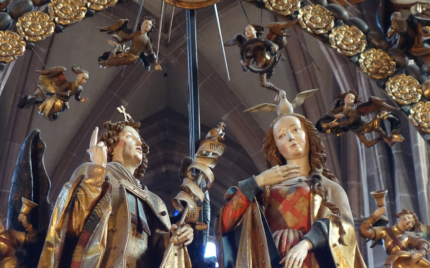 The iron chain from which it was suspended was changed to hemp to save money (?) and the rope broke in 1817, damaging the painted wooden figures.