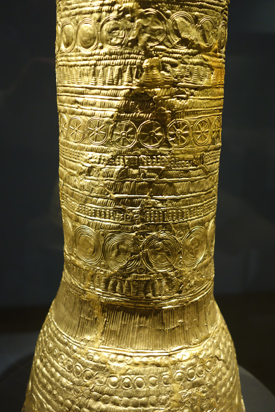 It is covered with sun symbols and other stamped designs.