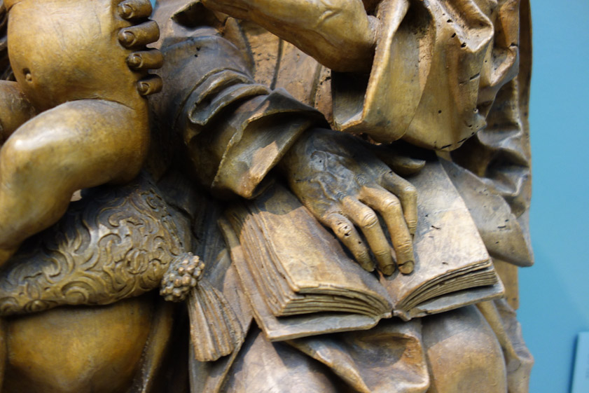 Saint Anne's  hand shows the wood carver's skill in realistic depiction of the effects of age.