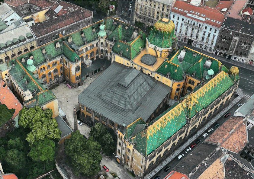 The large green and yelow dome which is the main exterior feature is over the entrance. The skylight in the previous slide is behind it. The main hall with an arcade of Moorish arches is under the gray rectangle. There is another skylight in the middle of the rectangle.