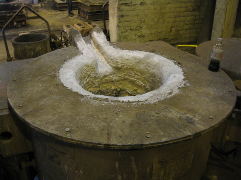 This is the top of one of the two furnaces where casting metal is blended and melted at Erhart.