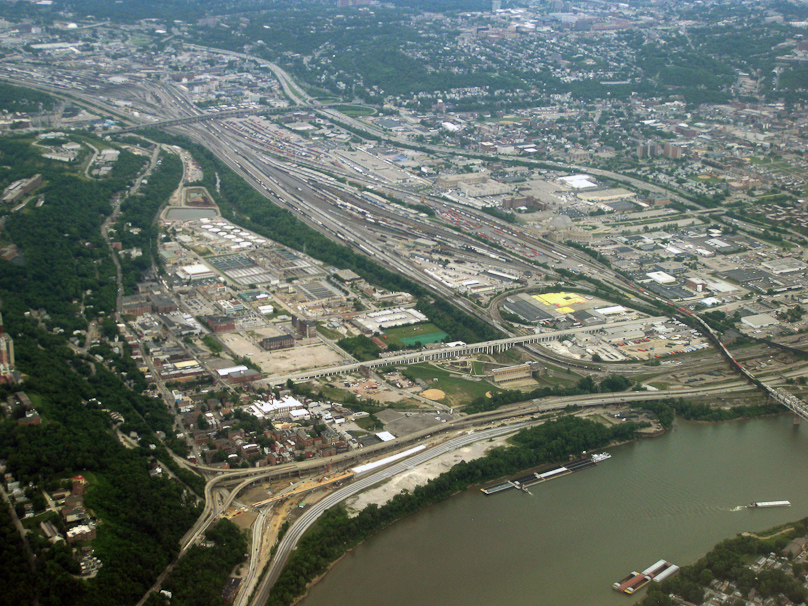 As our plane left Cincinnati we could see the Ohio River at the bottom and Mill Creek coming down from top left, flowing through the narrow strip of green trees, under a long viaduct on pillars, past the flood control dam and under an interstate highway at the edge of the Ohio River.