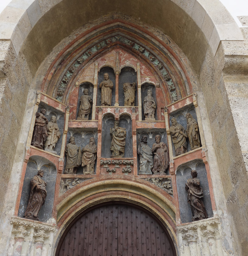 The south portal is 14c Romanesque, made by the Parler family of Prague.