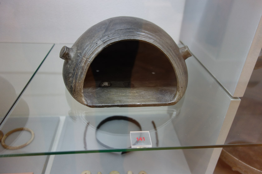 Another bread oven. The lugs on either side might have been handles to put the oven on or take it off a bed of coals.