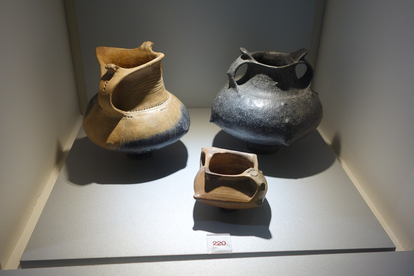 These pots have striking character, with interesting flaring at the  opeing, tapered handles, and subtle little projections (nipples?)