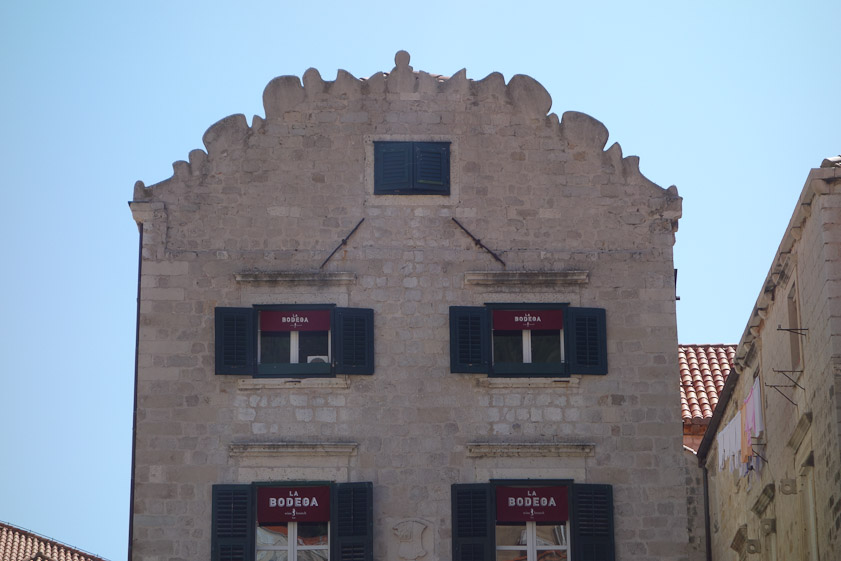 Unusual, craggy pediment.
