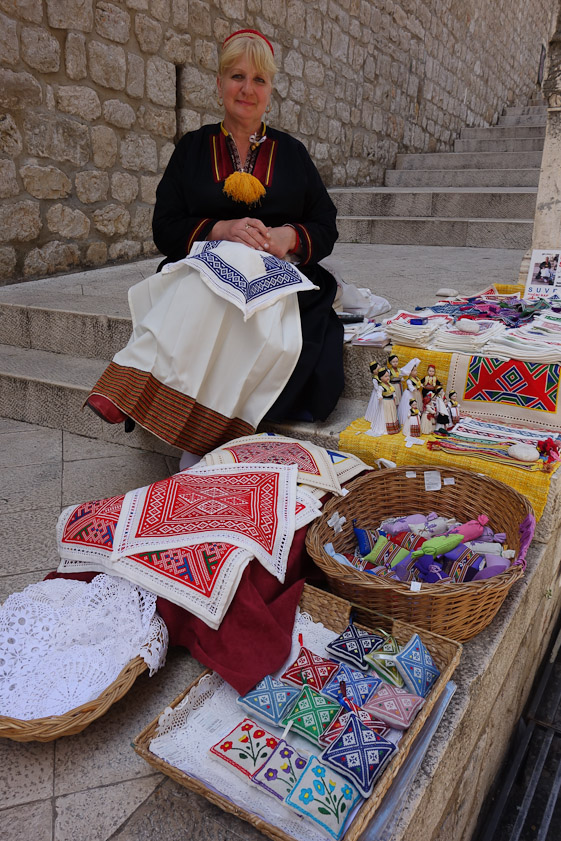 Mariana bought one of the red embroideries from this woman on the steps up to the Dominican monastery.