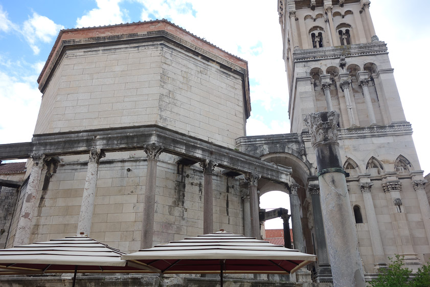 Looking south at the 3c Mausoleum and the 12c tower. The octagonal arcade used to support a slanted roof forming a covered porch surrounding the Mausoleum.