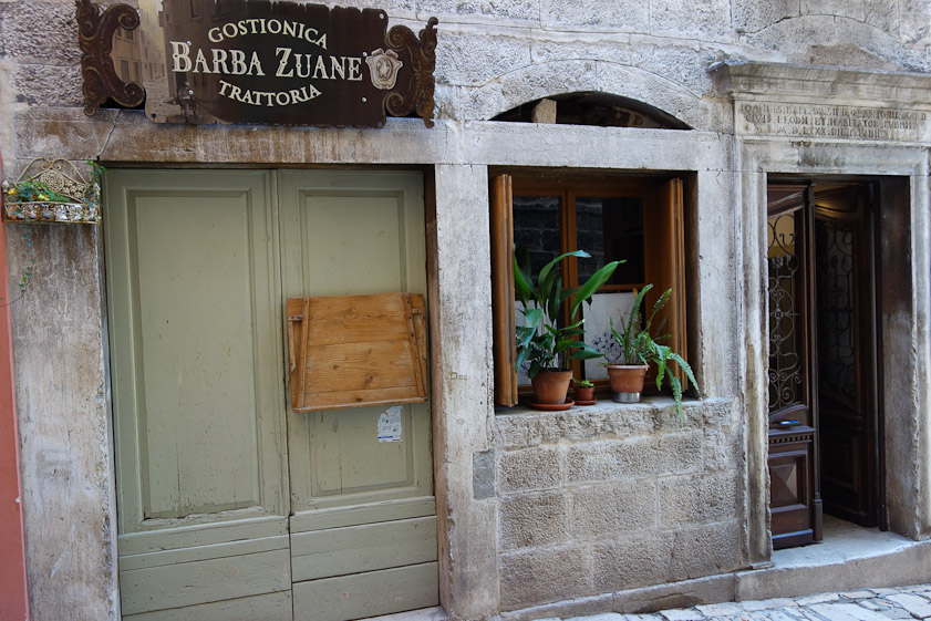 The front of our lodgings in Rovinj, one of at least two owned  by Casa Garzotto. We ate breakfast in the gostionica (trattoria) next door and had one excellent impromptu dinner there. The inscription in stone over the door says that it was built in 1580.