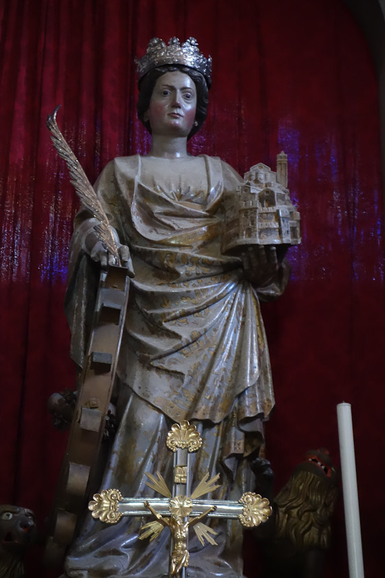 A statue of St. Euphemia, the martyr  whose relics are preserved in the cathedral. She was killed on a wheel in Calcedon in 304 AD. When the Persians captured Calcedon her relics were moved to Constantinople. Iconoclasts forced the dispersal of relics, and her stone sarcophagus was found floating in the sea off Rovinj (!). She holds a model of the city with her church.