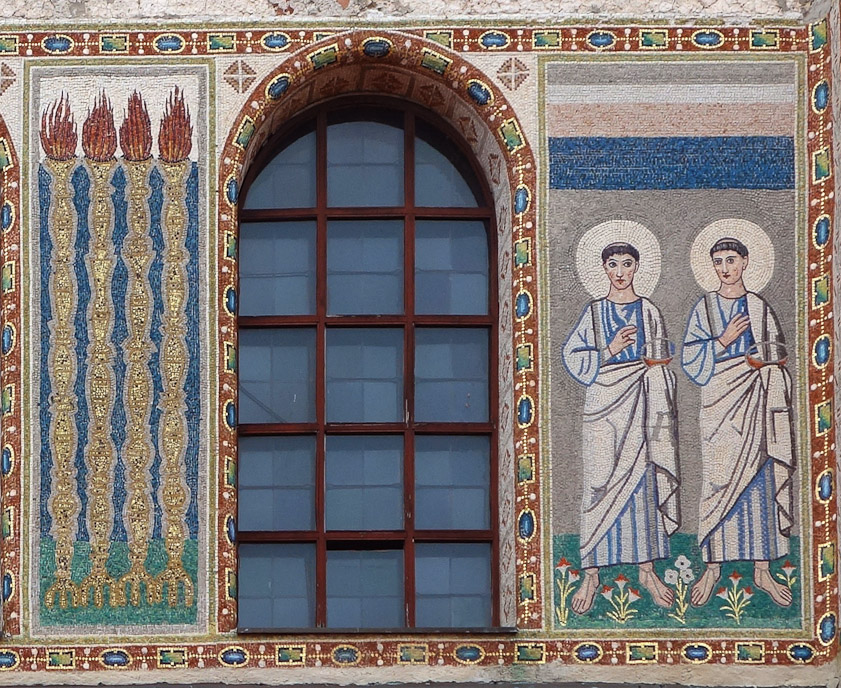 I wish I understood the symbology of the hand gestures, the layers of color above the two haloes, and the torches on the left.