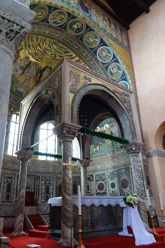 The baldachin shelters the altar.