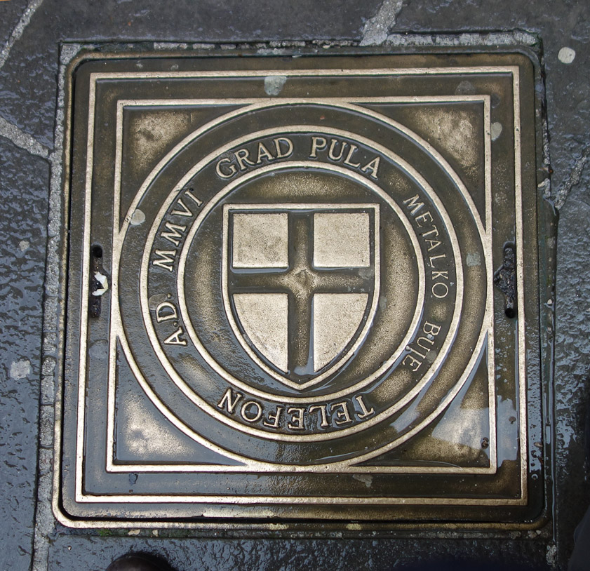 MMVI means 2006, so a new manhole cover in Pula.