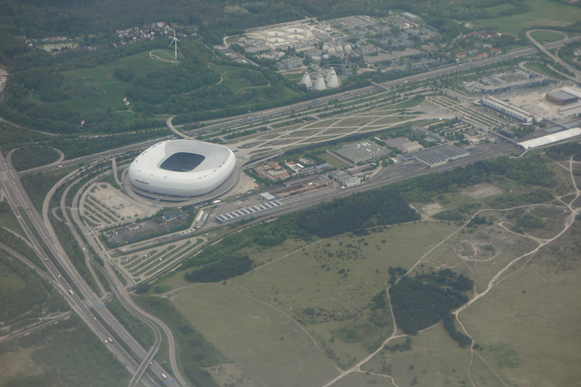 We flew over two interesting structures which we later learned were the Alianz Stadium (the smooth square donut) and a water treatment plant (the three conical towers top center).