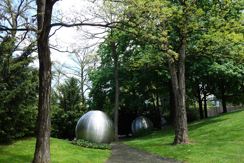 Stainless steel balls litter the grounds of a European Union building on the bank of the Isar River, across from the Deutsches Musuem.