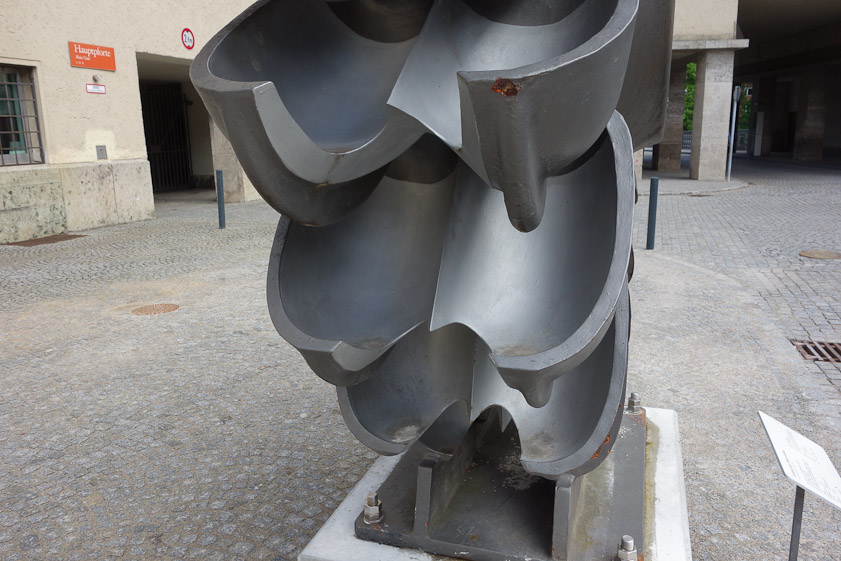 The cups of a Pelton wheel have a septum to divert the water jet into a 180º flow for maximum momentum transfer to the wheel.