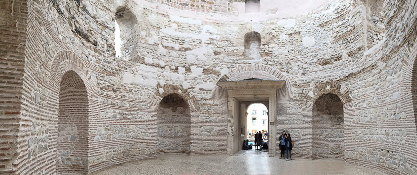 Passing through the portico you enter the Vestibule, a circular room leading to Dioclletian's private quarters. It used to be covered by a dome. This is a view north, toward the Peristyle through the doorway.