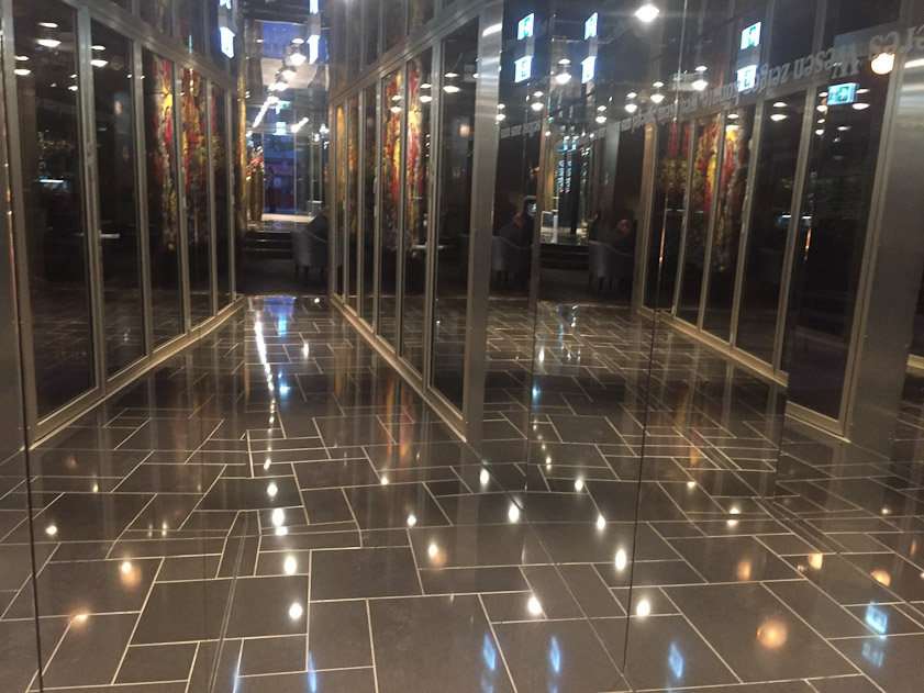 A narrow ground floor corridor lined with mirrors connected the front of the hotel to the back.