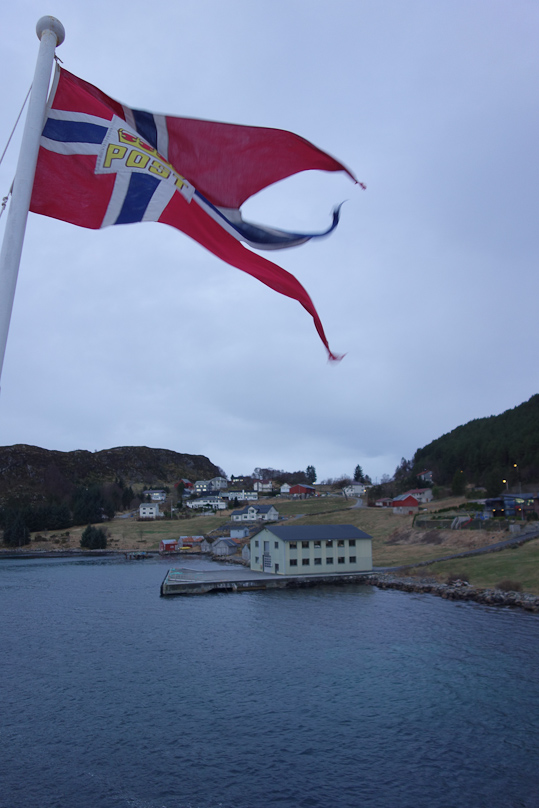 We stopped briefly at Torvik, a little south of Ålesund. The ship's flag shows that the Hurtigruten carries the Norwegian mail.