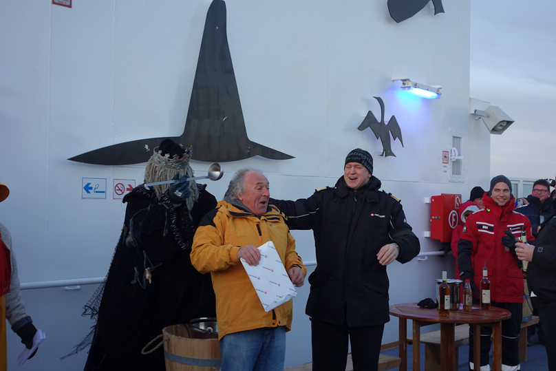 The winner of the contest to guess the precise time we would cross the Arctic Circle got his prize and then a ladle of ice water down his neck, delivered by Father Neptune.