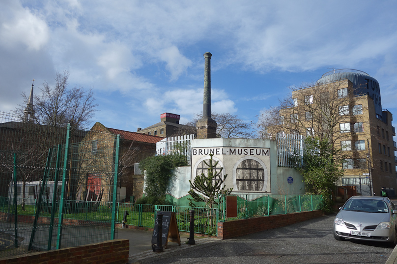 The Brunel Museum in Rotherhithe includes a brick building with smokestack (left) that housed a steam engine to pump water out of the tunnel, and a cylindrical entrance hall (white structure).