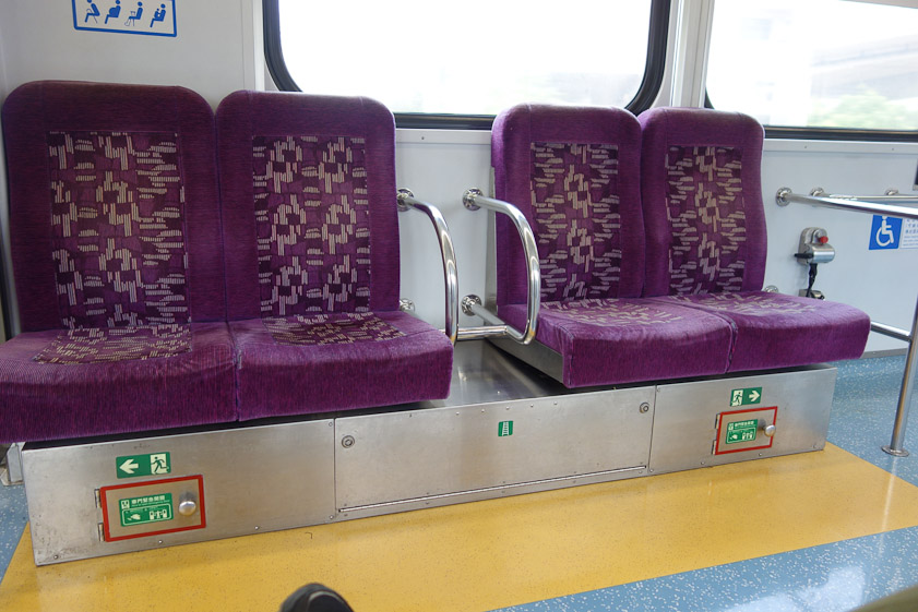 The train we caught at Taichung station to go to the Jiji Railroad left town on an elevated track. The escape equipment was stored under these seats.