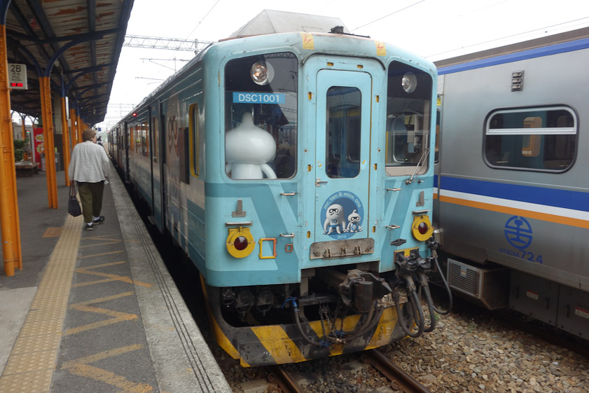 At Ershui Station south of Taichung we transferred to this car of the Jiji Line. Note the white figures on the front of the car: Mr. Ten and Miss One.