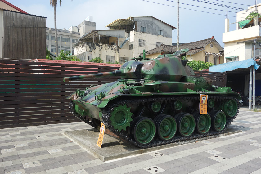 There is an army base at Longquan, one stop before Jiii, that probably is the source for this surplus tank at Jiji Station.