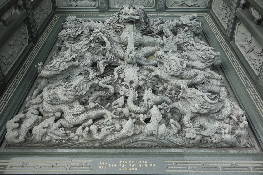 Elaborate carving between the entry stairs (on the right) and the exit stairs (always on the left in a traditional temple).