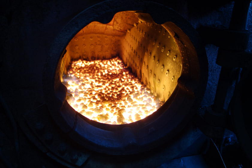Burning coal sitting on a grate under which air enters to keep the fire burning. The firebox is surrounded by water. Hundreds of staybolts connect the firebox to the boiler, supporting it and forming other means of transmitting heat to the water. The pressure in the boiler can be as high as 300 psi, so the staybolts keep the firebox from collapsing.