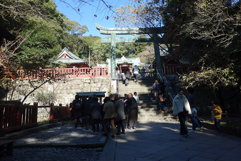 We stopped at level 2. Level 3 is 19 step up and under that stone torii. That level has a large belfry that became a drum dower when Shinto shrines were stripped of their Buddhist fittings  in 1873 under the prohibition of hybrid worship. Temples lost a lot of support and had to sell off some of their treasures, e.g. to Charles Lang Freer and benefactors of the Boston Museum of Fine Art.