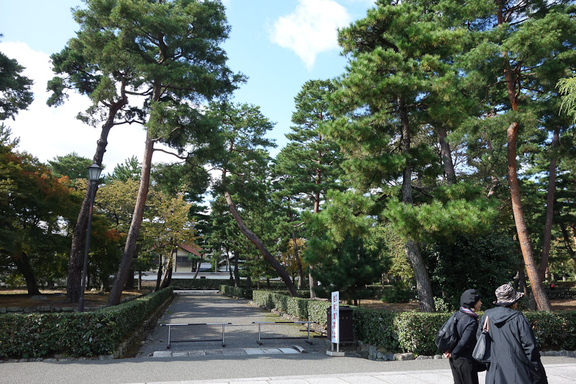 The grounds have several unoccupied lots, delimited by hedges, as though large houses had once been there.