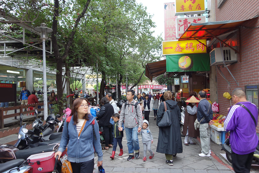 Here we are in a park lined with shops approaching Lungshan Temple in Taipei