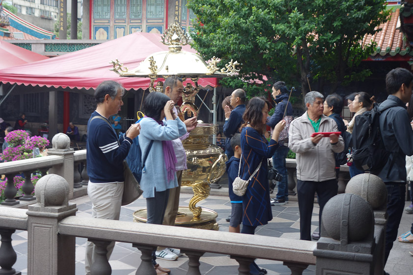 On the porch they light incense and pray with their hands together.