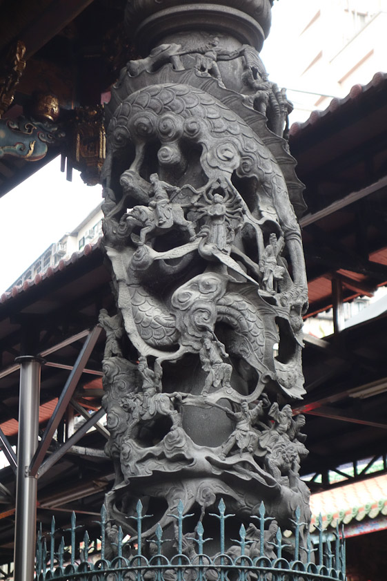 It's hard to see what's happening in this carved column, but there's a huge dragon and various small human figures.