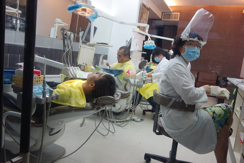 We walked past several modern streetfront cllnics with dentists and technicians at work on patients.
